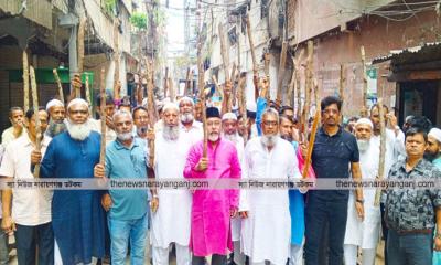 চাঁদাবাজিতে অতিষ্ঠ হয়ে ব্যবসায়ীদের লাঠি মিছিল